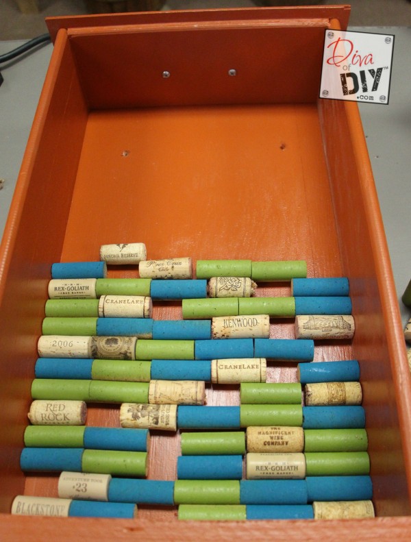 Looking for a unique corkboard idea? Make this DIY cork board with a repurposed drawer and wine corks! The perfect repurposed items project! Cork Crafts!