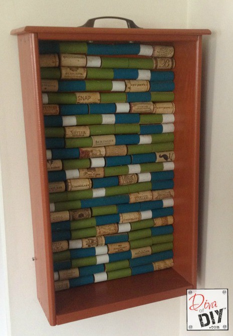 Looking for a unique corkboard idea? Make this DIY cork board with a repurposed drawer and wine corks! The perfect repurposed items project! Cork Crafts!