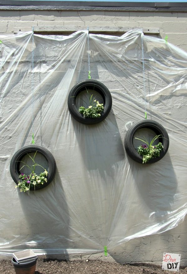 These Tire Planters will make a great conversation piece in your space! An easy bright tire upcycling DIY project that will add fun to your outdoor decor!