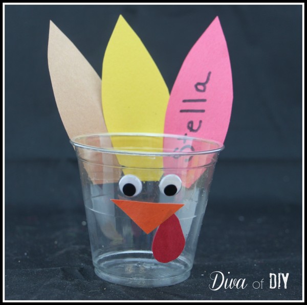 Keep drinks separated with these adorable personalized turkey cups for your Thanksgiving kids table decorations. Kids can make and decorate themselves!