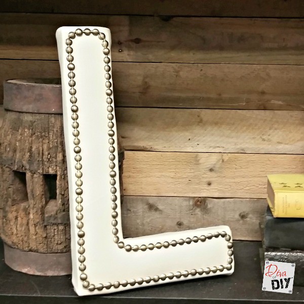 Make a statement with this upholstered monogram letter with nailhead trim. Made with a paper mache letter and left over vinyl fabric. The perfect home decor