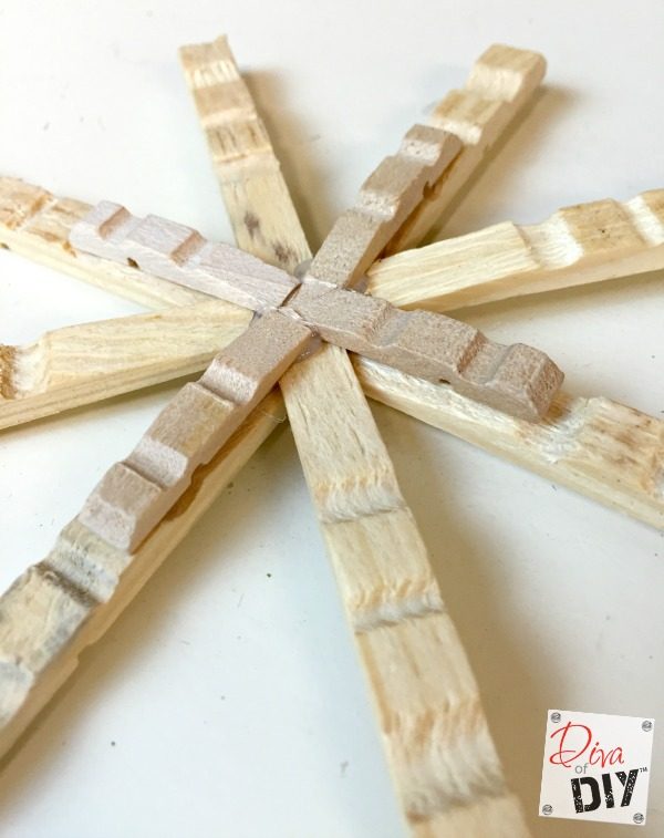 Clothespin crafts are fun for all ages! These clothespin snowflake ornaments are quick and easy to make Christmas ornaments with a rustic or glitter flair!