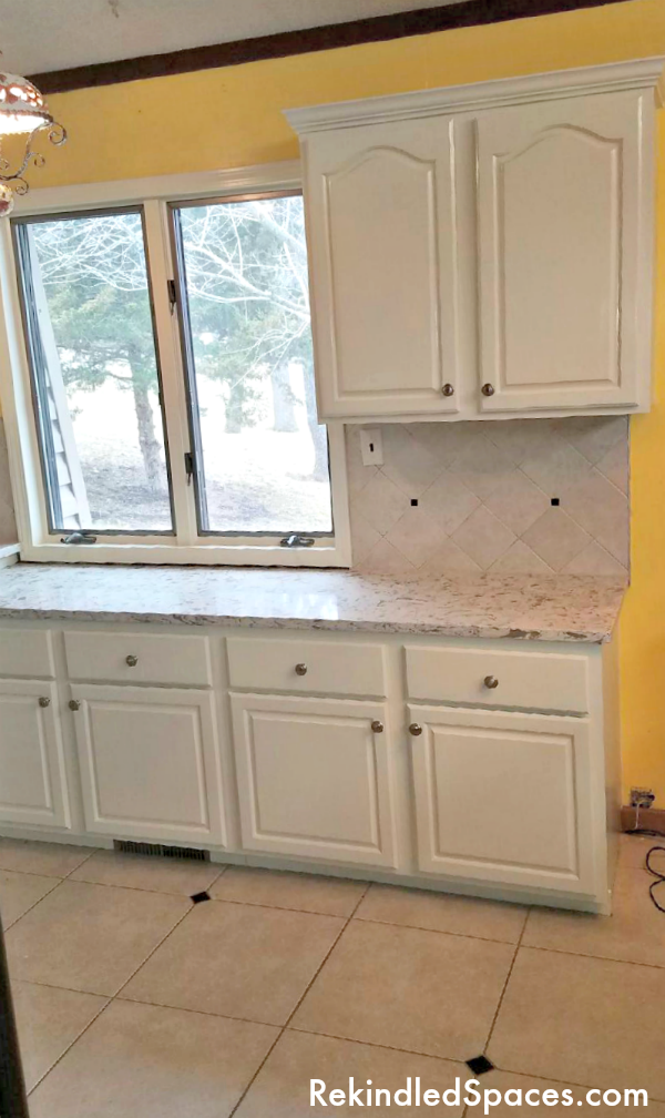Are your tired oak kitchen cabinets ready for a makeover? Tips and tricks from a professional for painting kitchen cabinets with bonus makeover design tips!