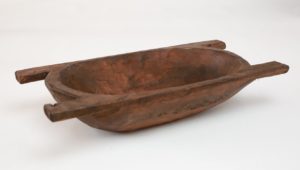 This wooden dough bowl will look great accessorized on your farmhouse table
